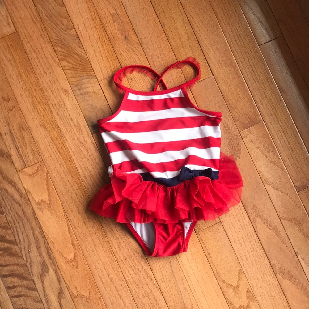 Adorable girls red white and and blue swimsuit.